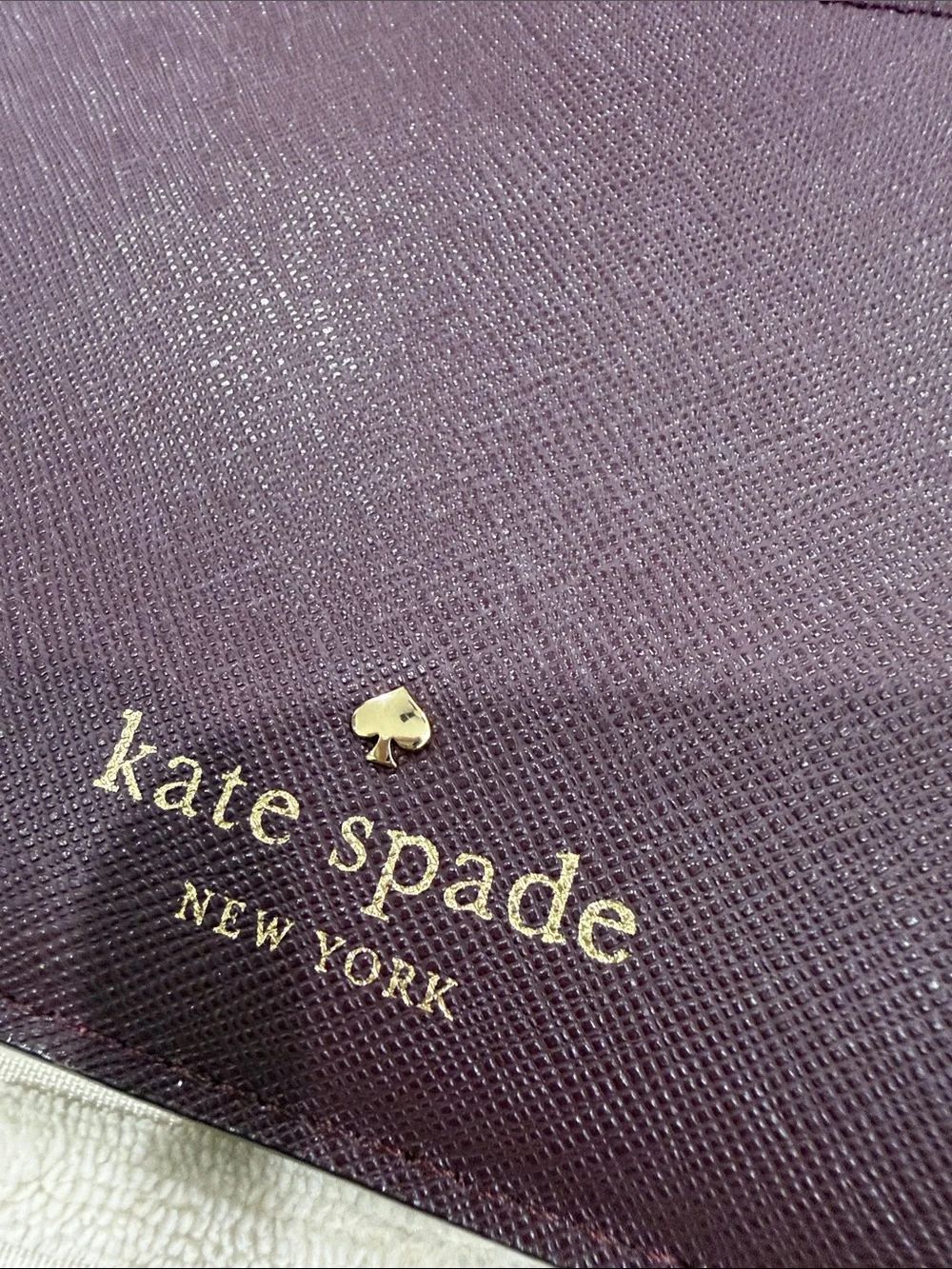 kate spade Plum Textured Wristlet Clutch with Gold Logo